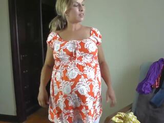 Sedusive pregnant girlfriend trying on dresses
